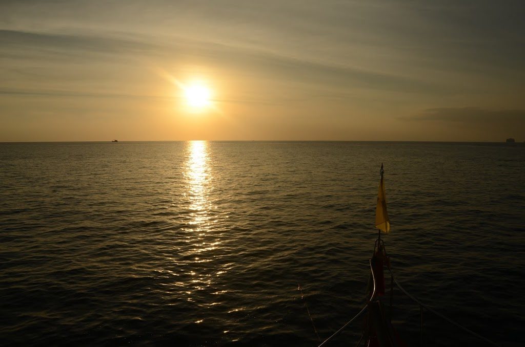 Sunset at Koh Maa, viewed from snorkeling boat. Koh Lanta sunset.