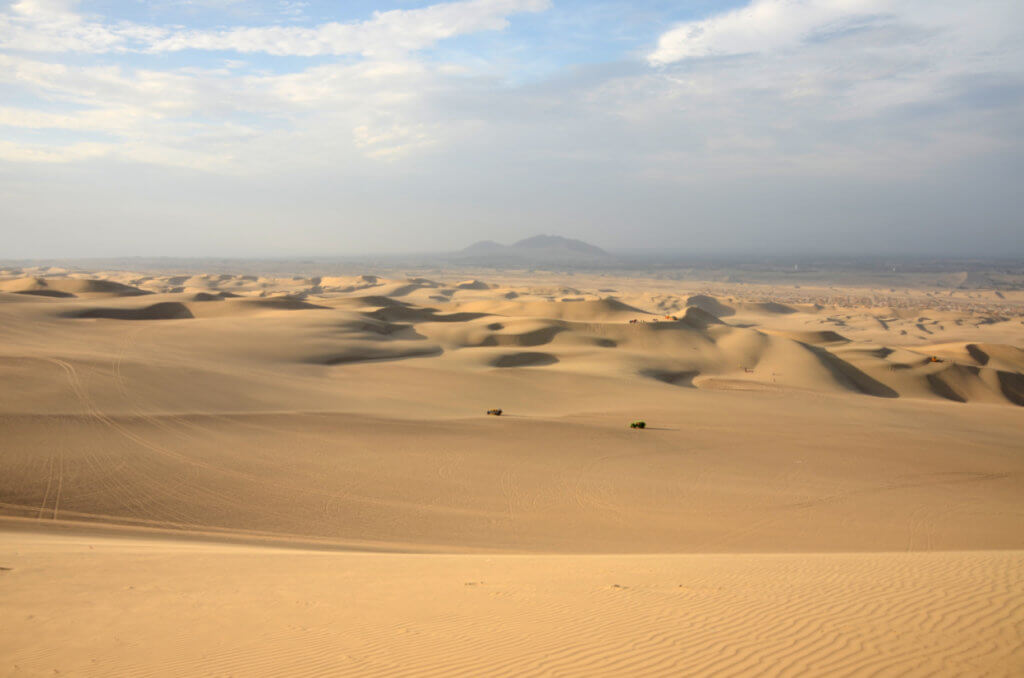 The beautiful sand dunes of Huacachina, one of the 4 Peru highlights south of Lima. Others are Ballestas, Paracas, Nazca