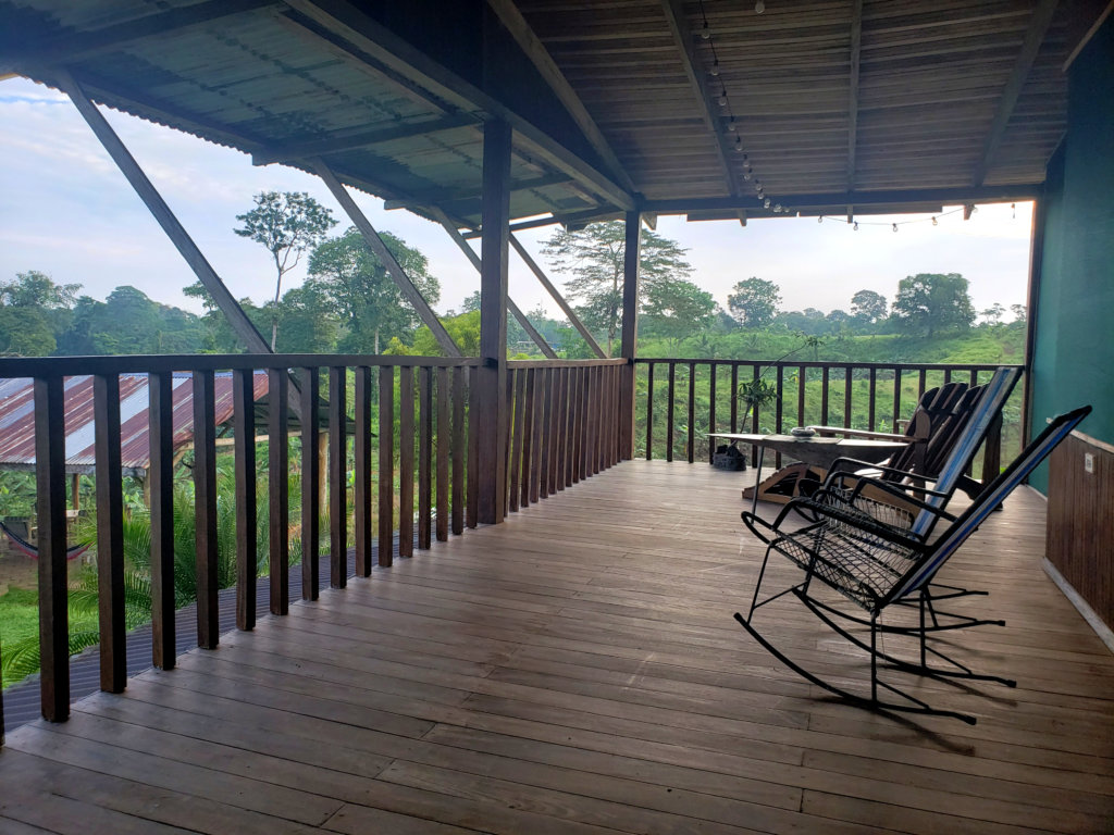 Morning at the balcony. Some chairs laid on the wooden platform.