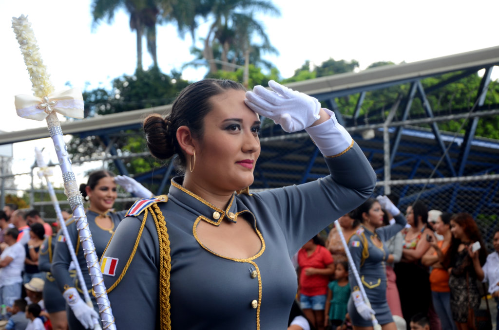 A woman saluting, Heredia parade - Costa Rica independence day celebration.