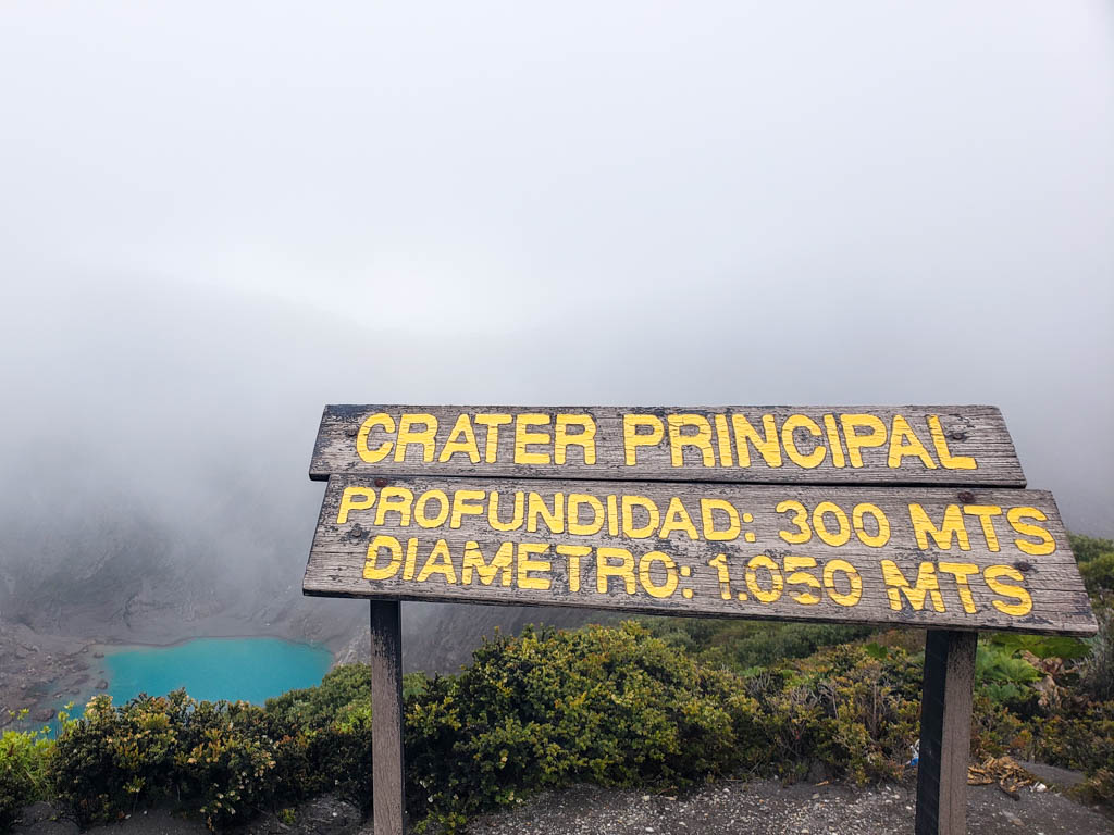 Signboard showing depth and diameter of the principal crater, Irazu volcano