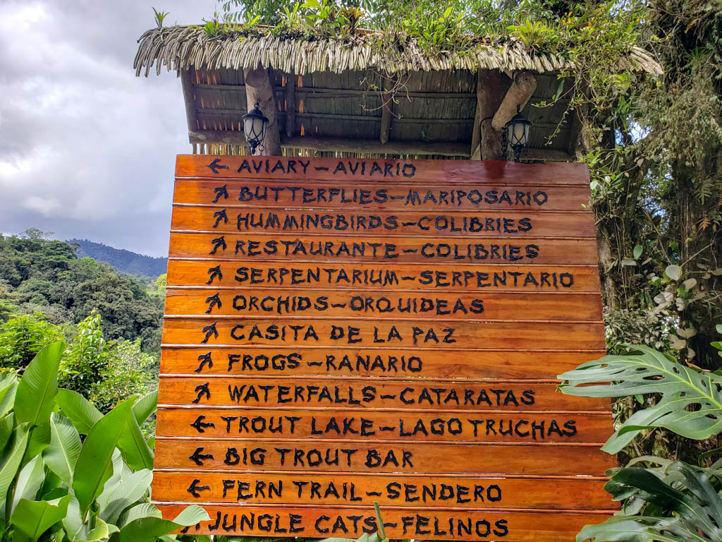 Direction marks towards different attraction areas of La Paz Waterfall Gardens Nature Park.