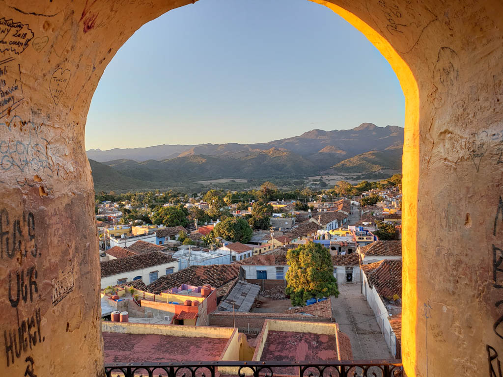 Trinidad town washed in golden glow of the setting sun, seen from the top of the bell tower.