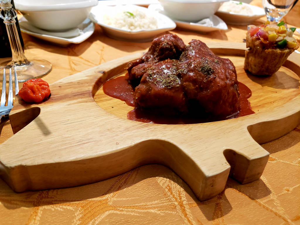 Fine dining in Varadero - steak and accompaniments on a wooden plate.