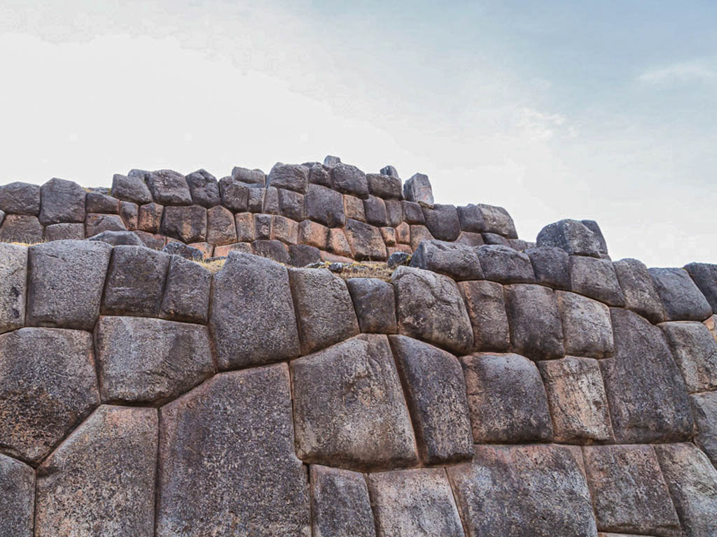 The large stone walls of Sacsayhuaman Fortress. One of the must-visit places of Cusco, Peru.