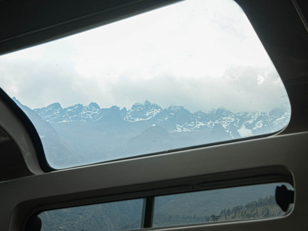 View of snow capped mountains from Vista Dome train to Aguas Calientes.