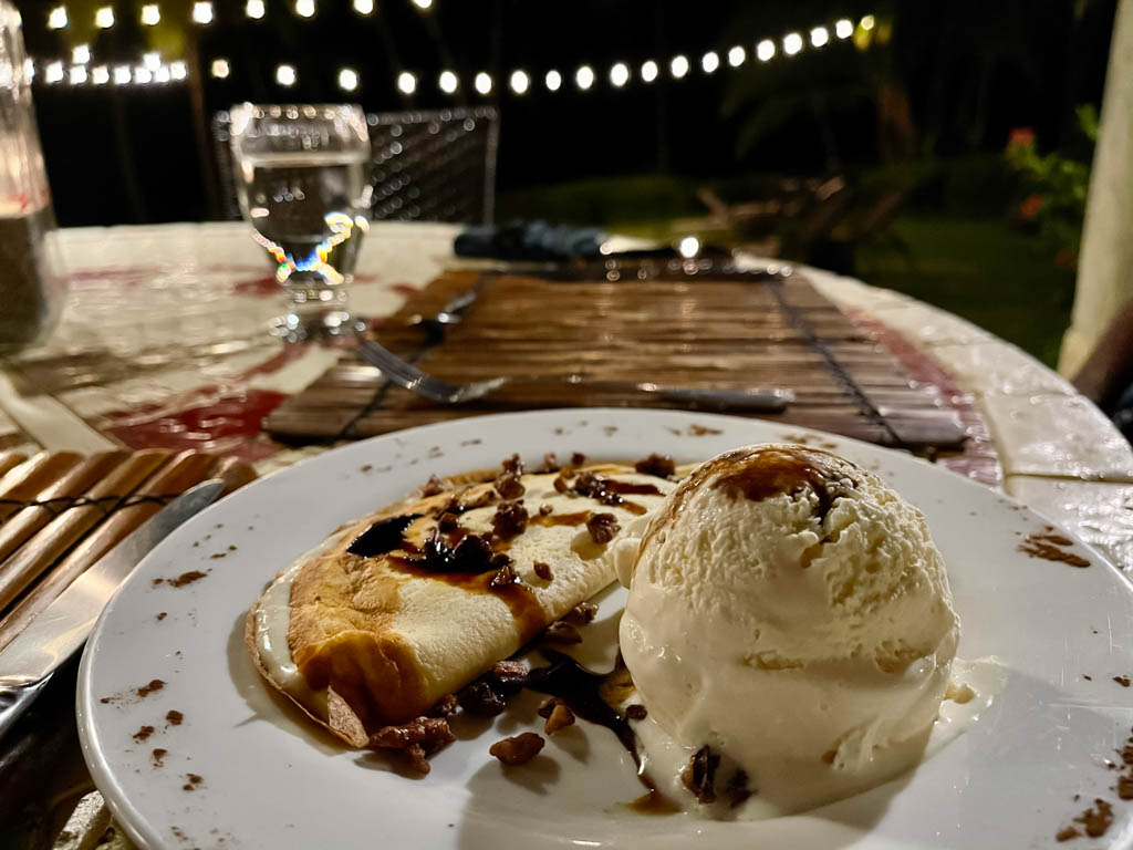 A plate with crepe and tiramisu ice-cream - romantic dinner at Ylang Ylang Beach Resort.
