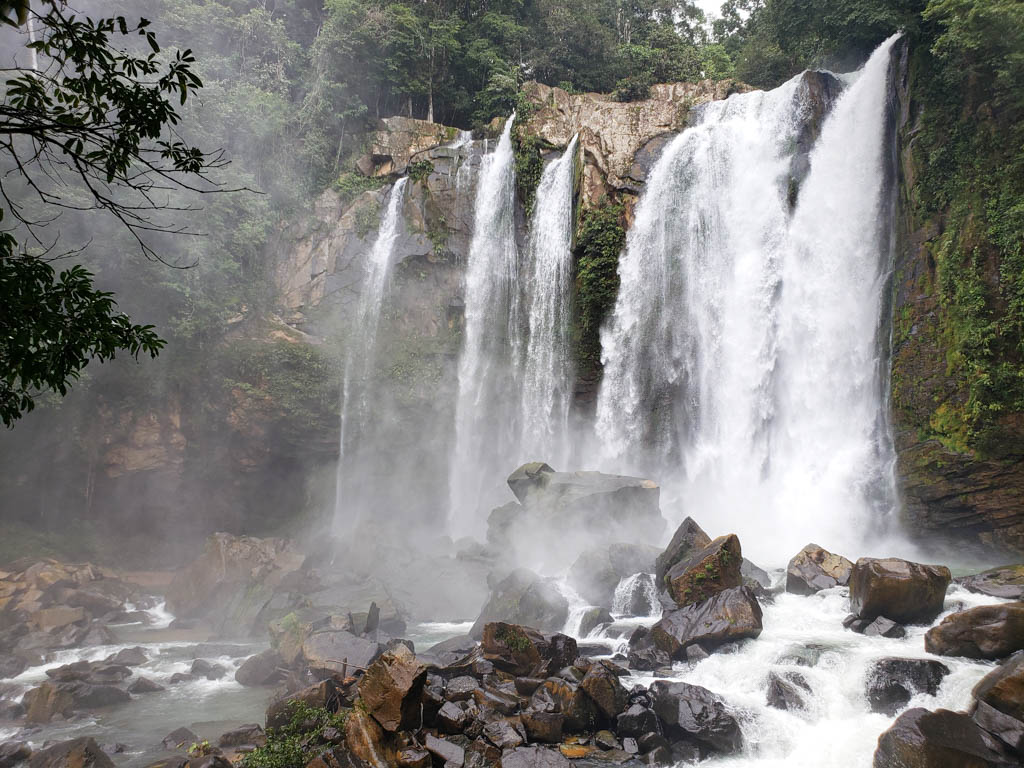 The upper fall of Nauyaca Waterfalls, in full bloom during rainy season in Costa Rica.