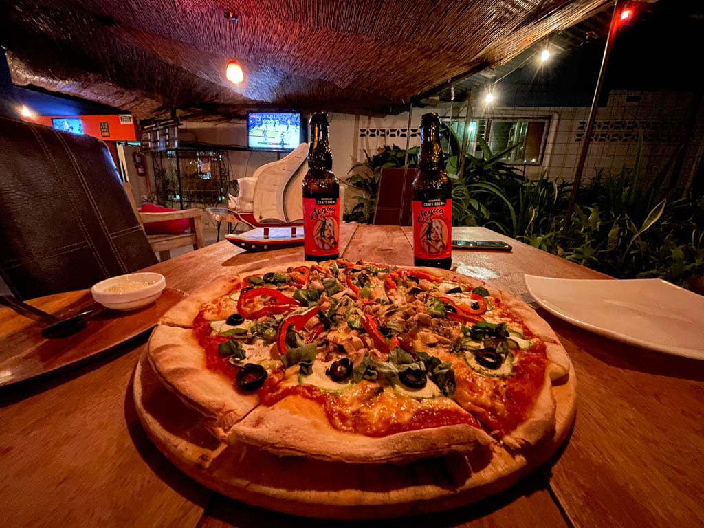 Pizza and Artesanal Cerveza at Salon El Higueron, a cool bar in Cabuya, Costa Rica.