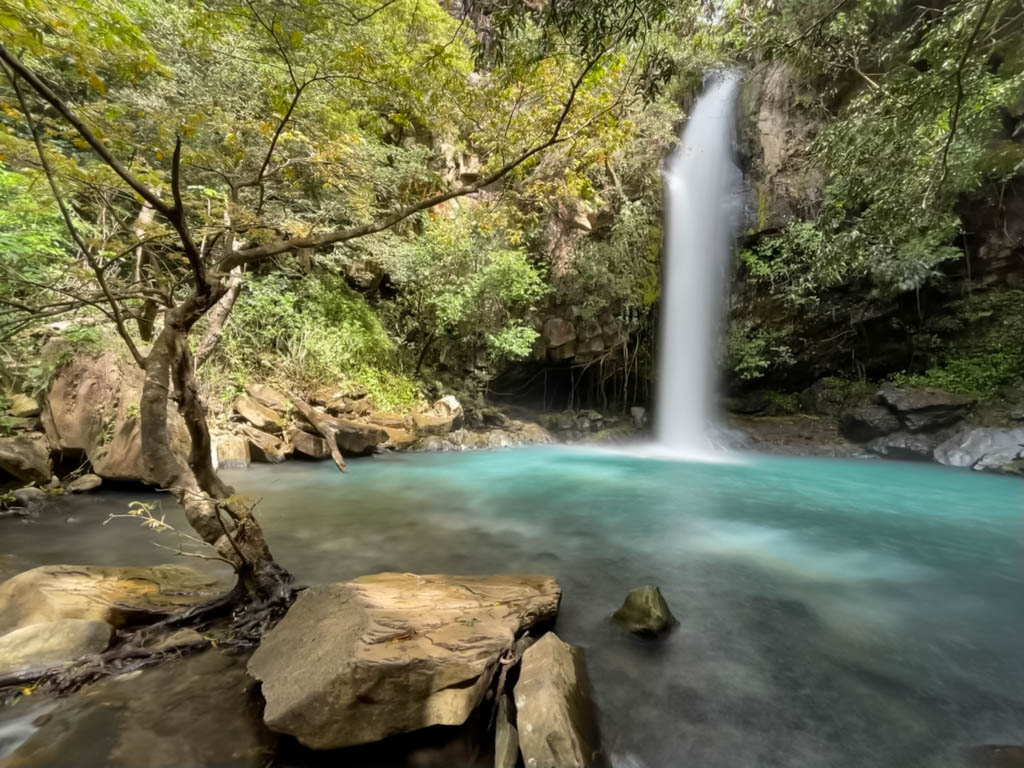 A long exposure shot of La Cangreja waterfall, a great inclusion in Costa Rica 10 day itinerary.