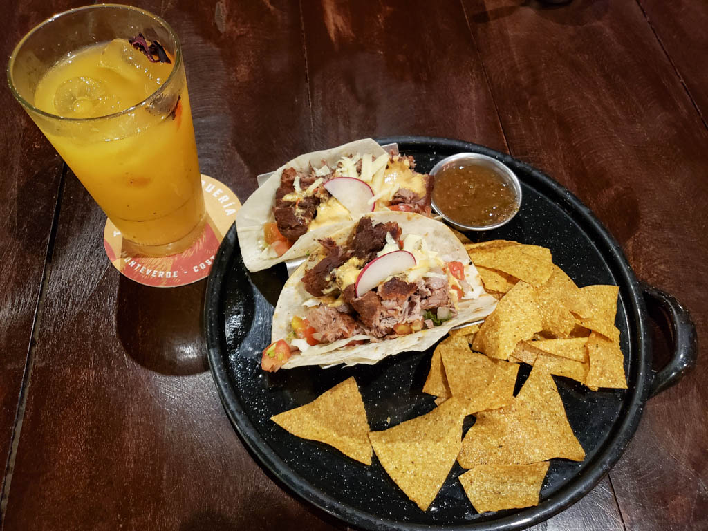 Tacos with tortilla chips + Passion fruit drink, at Taco Taco Taqueria.
