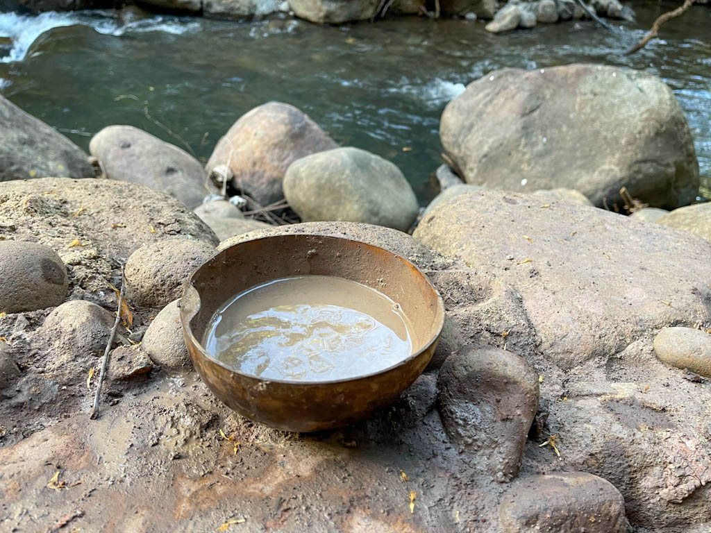 A bowl of volcanic mud next to the river, Rio Negro.