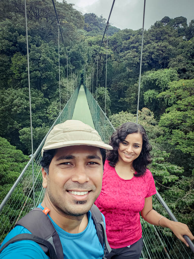 A man and woman on one of the hanging bridges in Sky Adventures Park, Monteverde.
