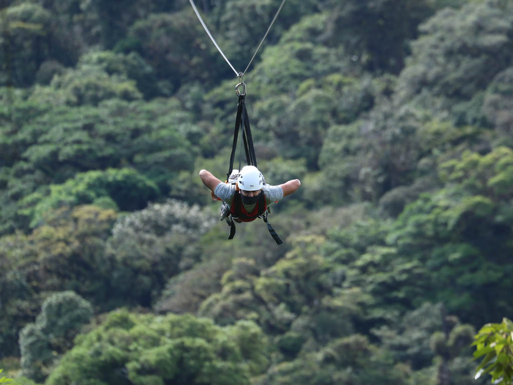 Zip lining over cloud forests of Monteverde in a Superman cable.