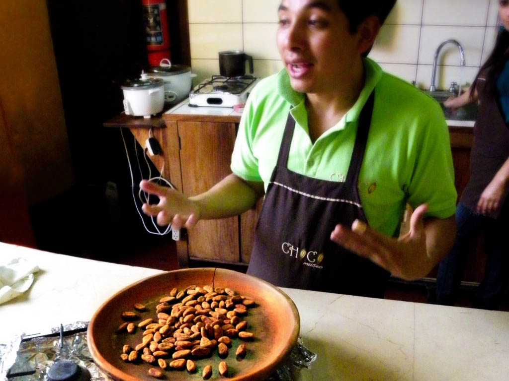 A man demonstrating Cocoa Beans at the Chocolate Workshop.