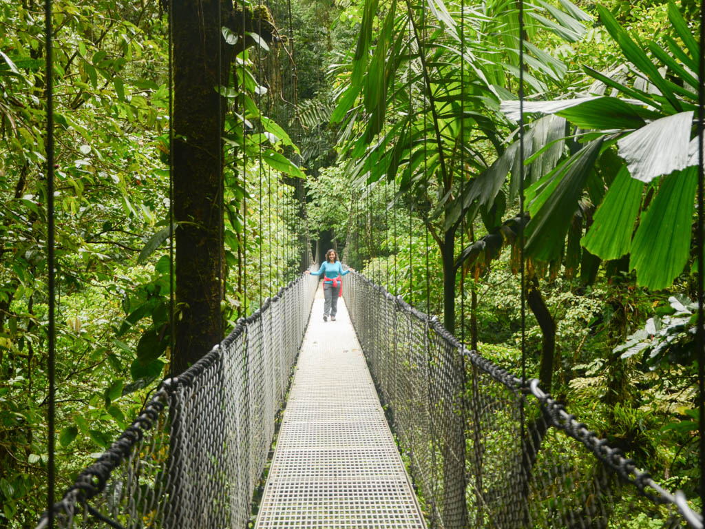 Woman, at one of the bridges at Arenal Mistico Hanging Bridges, a great addition on a La Fortuna itinerary.