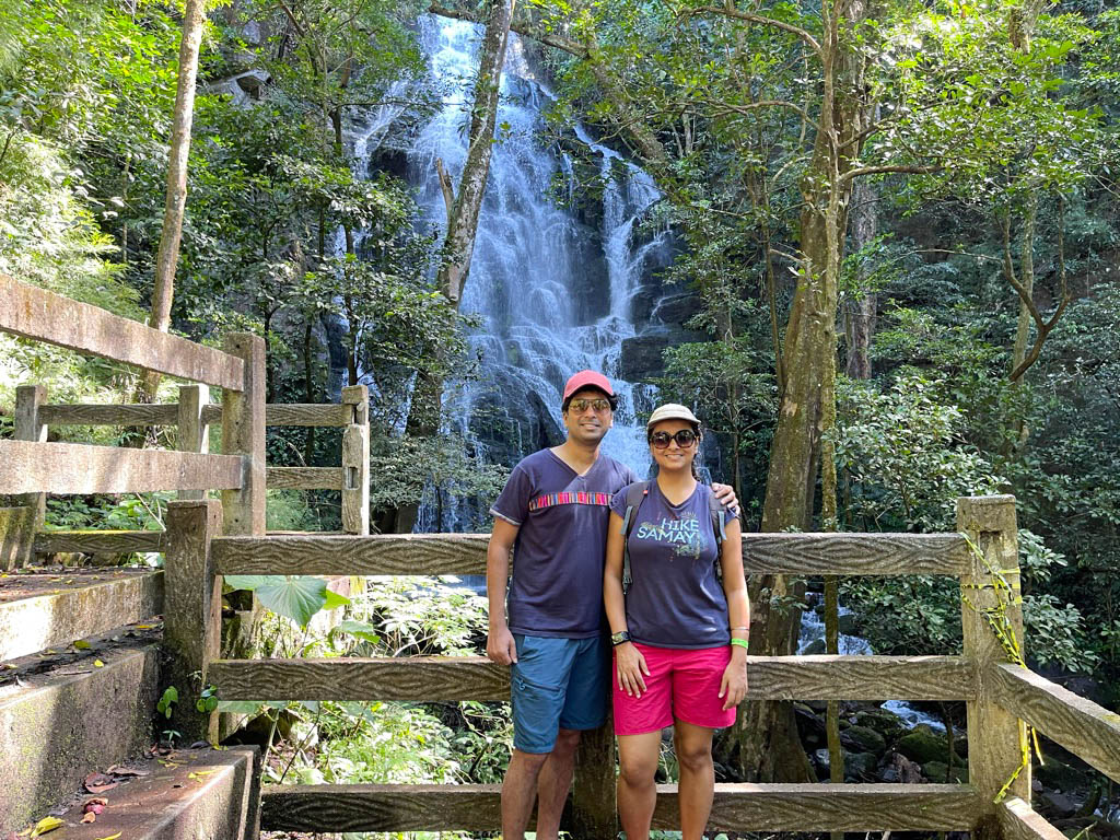 Couple standing near the seasonal waterfall in Las Pailas sector of Rincon de la Vieja National Park.