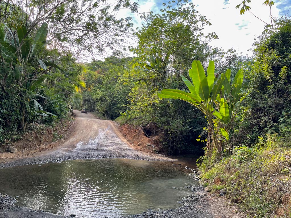 Road to Playa Ventanas, intercepted by a small river.