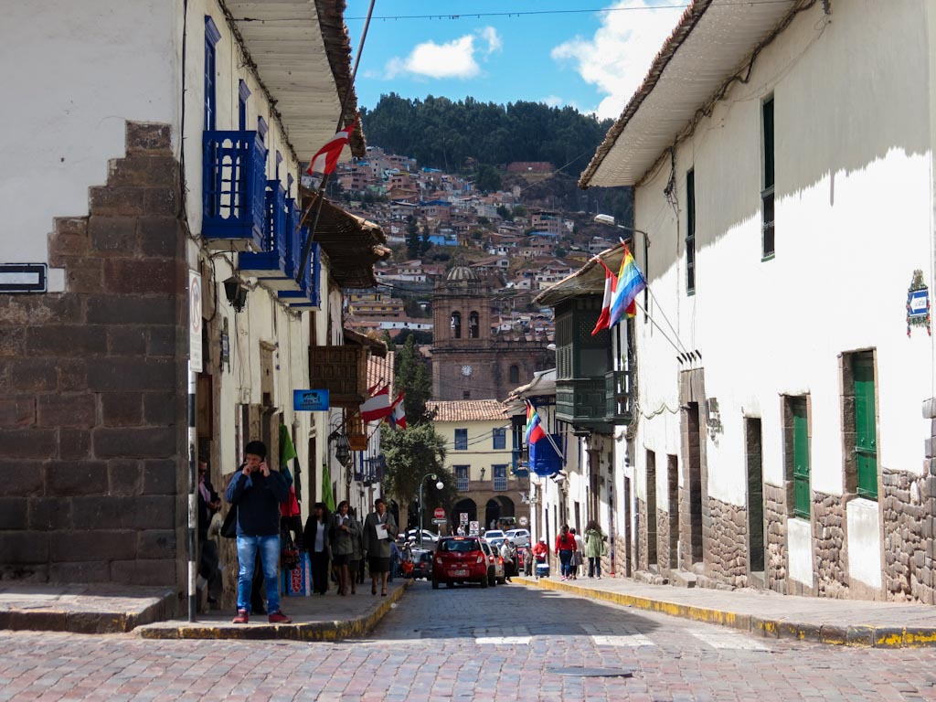 A busy cobblestone street of Cusco, one of the best places to visit in Peru.