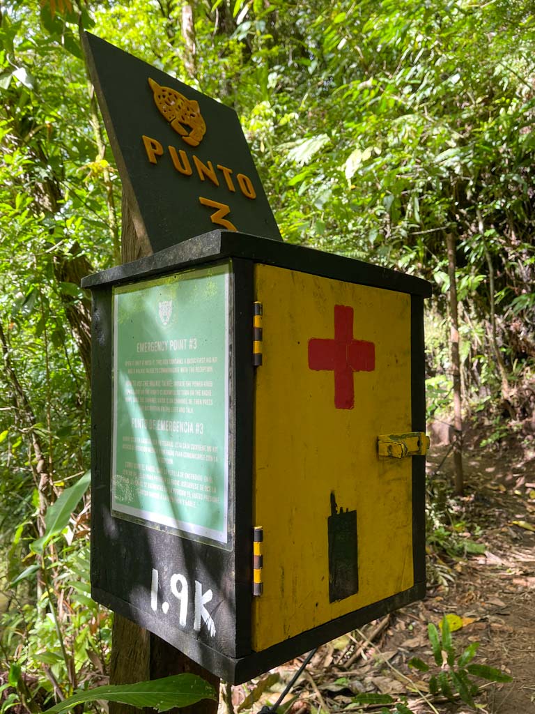 A yellow safety box on the hiking trail.