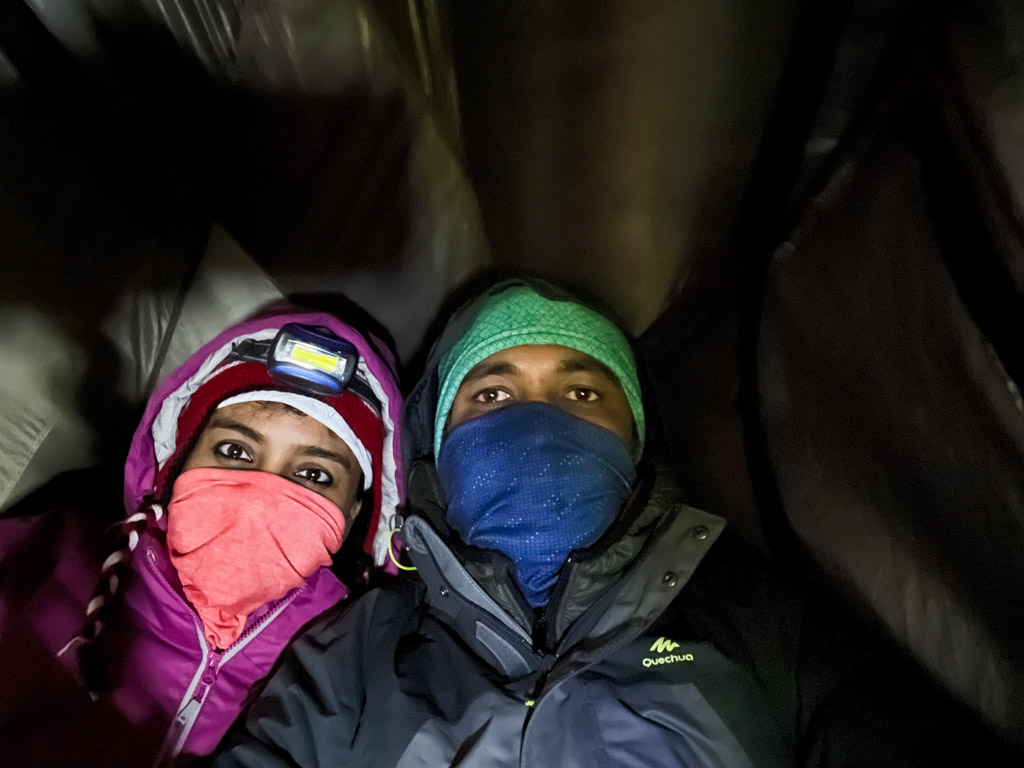 Selfie of a couple inside a tent at night, at Acatenango base camp.