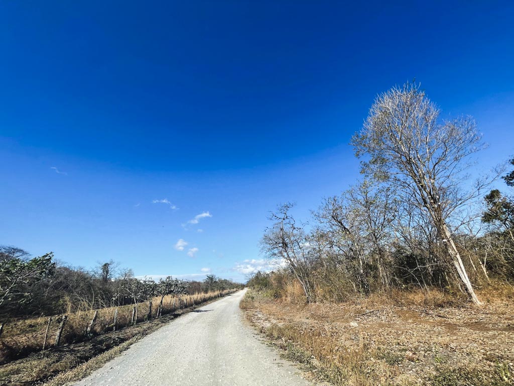 View of the unpaved stretch of the road after the waterfall entrance.