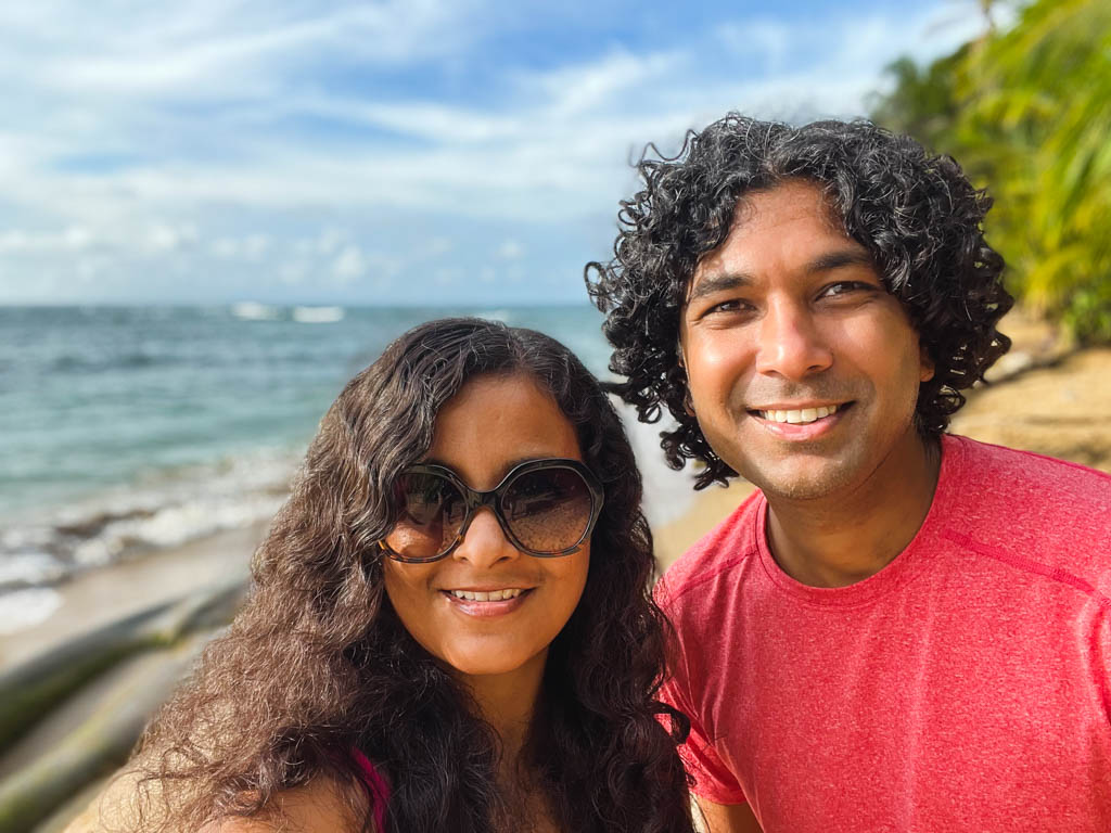 A couple posing for a selfie by the beach in Puerto Viejo de Talamanca.