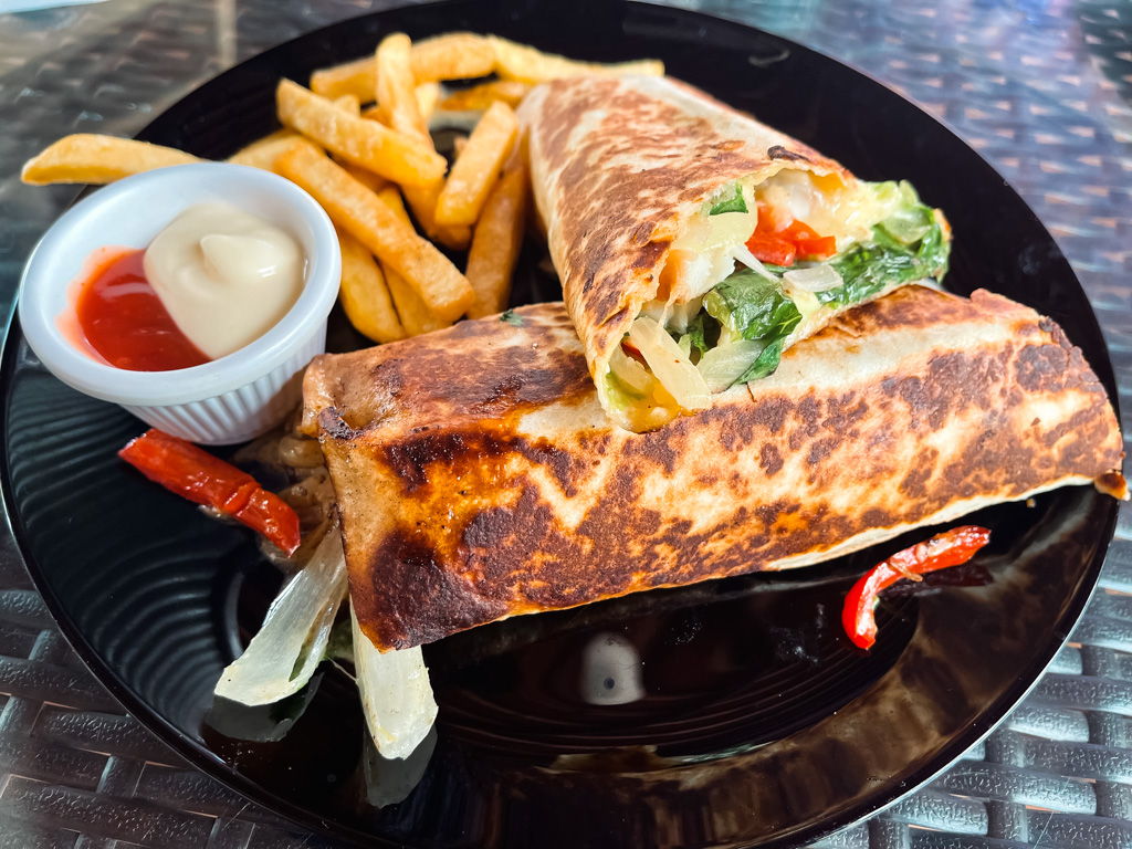 Fish wrap served with fries and salsa, at the Amor a Cafe restaurant in Uvita.