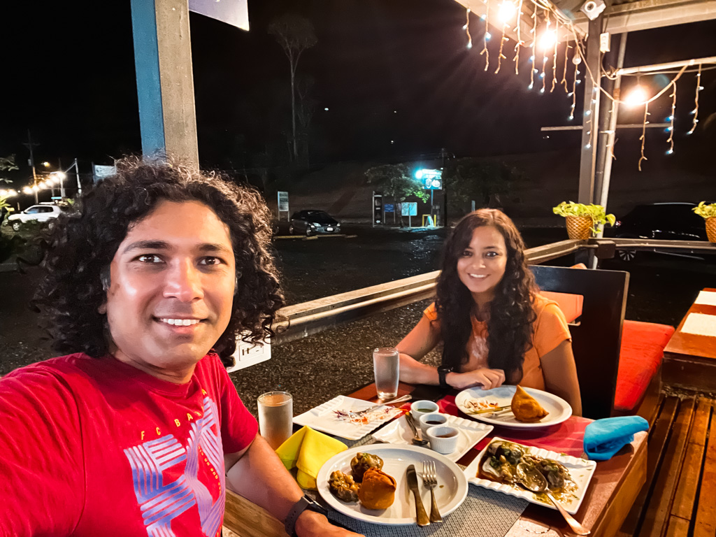 An Indian couple, having dinner at the Hola India restaurant in Uvita.