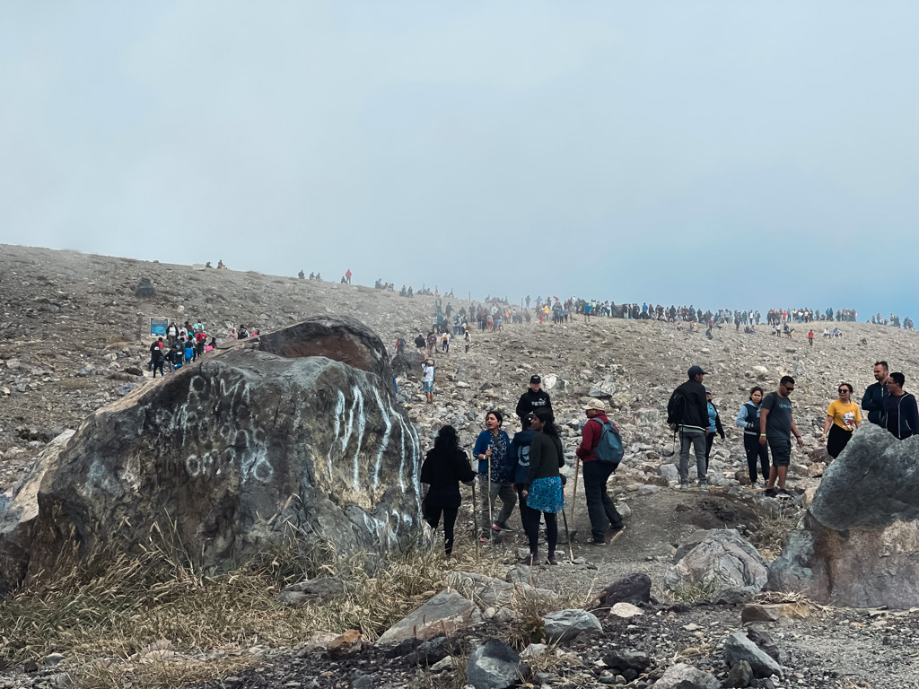 Hundreds of people near the Santa Ana volcano summit - a sight during busy holiday periods.