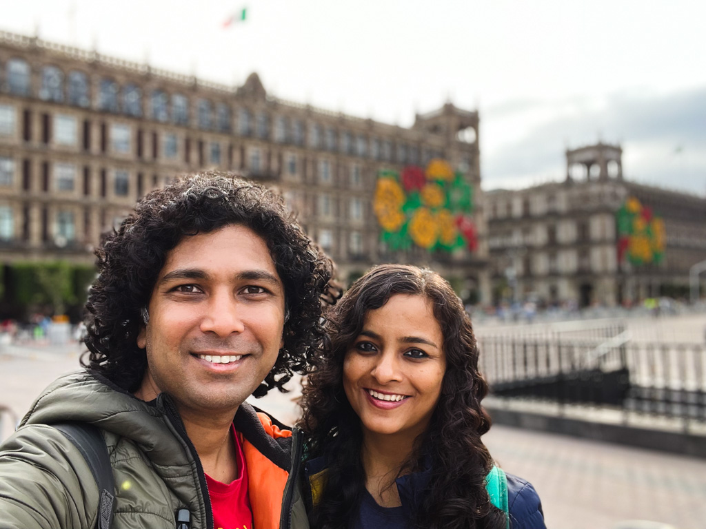 A couple posing for a selfie, at Zocalo, the historic center of Mexico City.