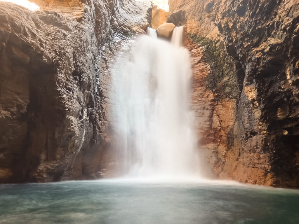 Long exposure shot of waterfall inside the cave.
