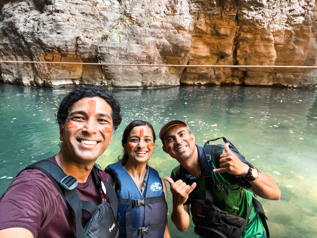 Couple standing with their guide Francisco during La Leona waterfall hike.