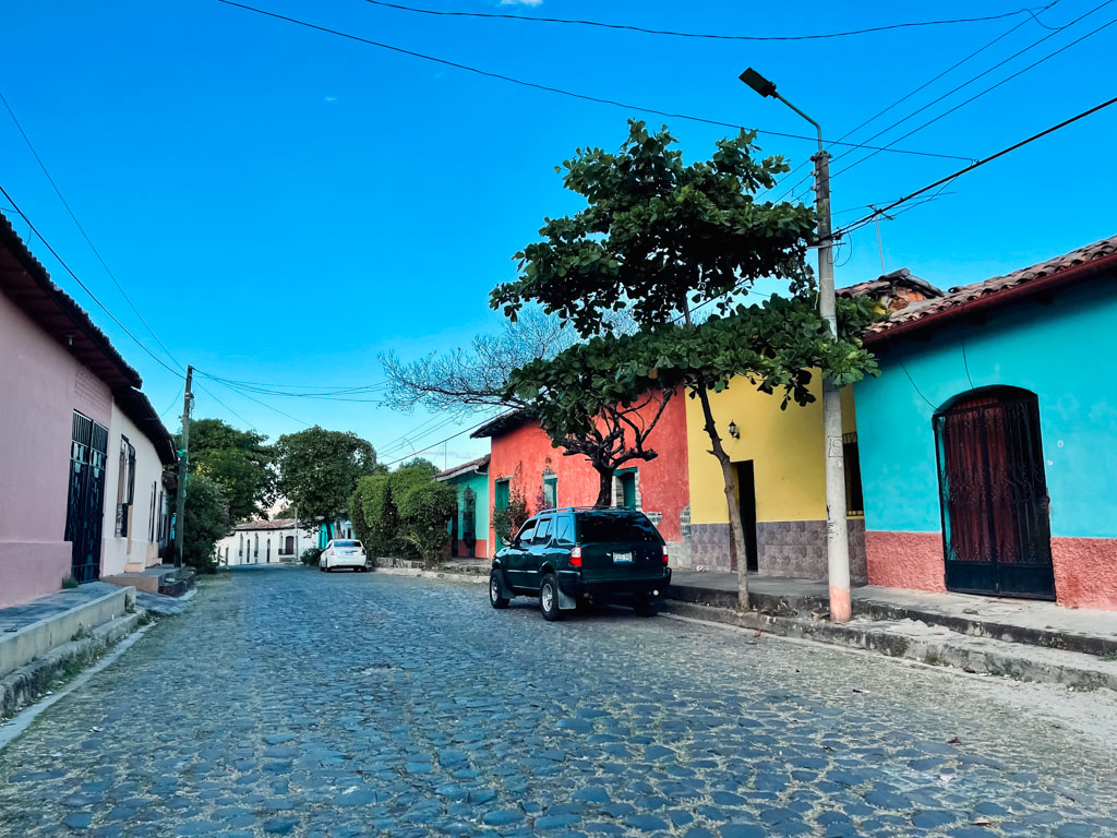Cobblestone street and colorful buildings of Suchitoto.