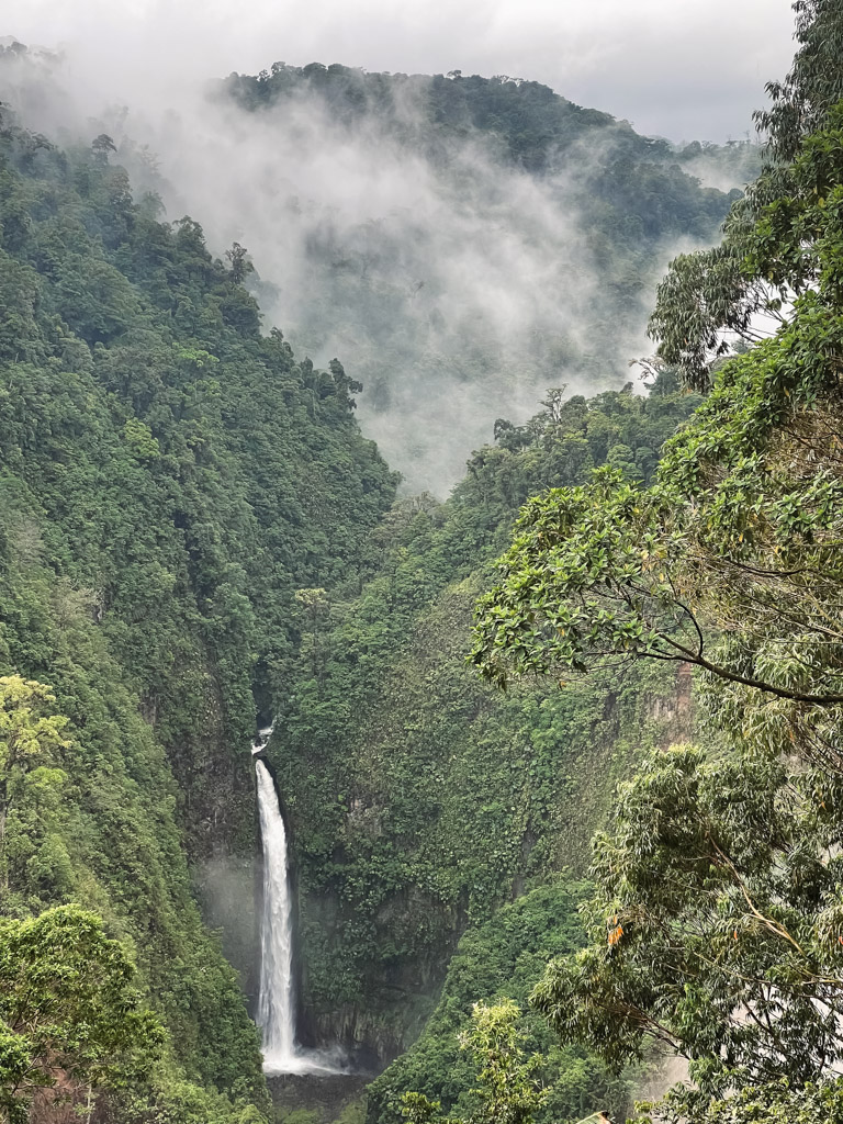 Clouds floating over Rainforests, and a panoramic view of Waterfalls in Costa Rica in Rainy Season.