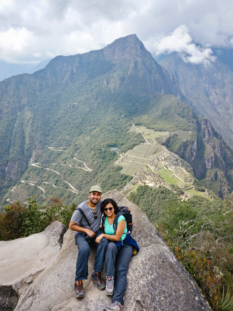 Couple, at the summit of Huayna Picchu mountain in Peru.