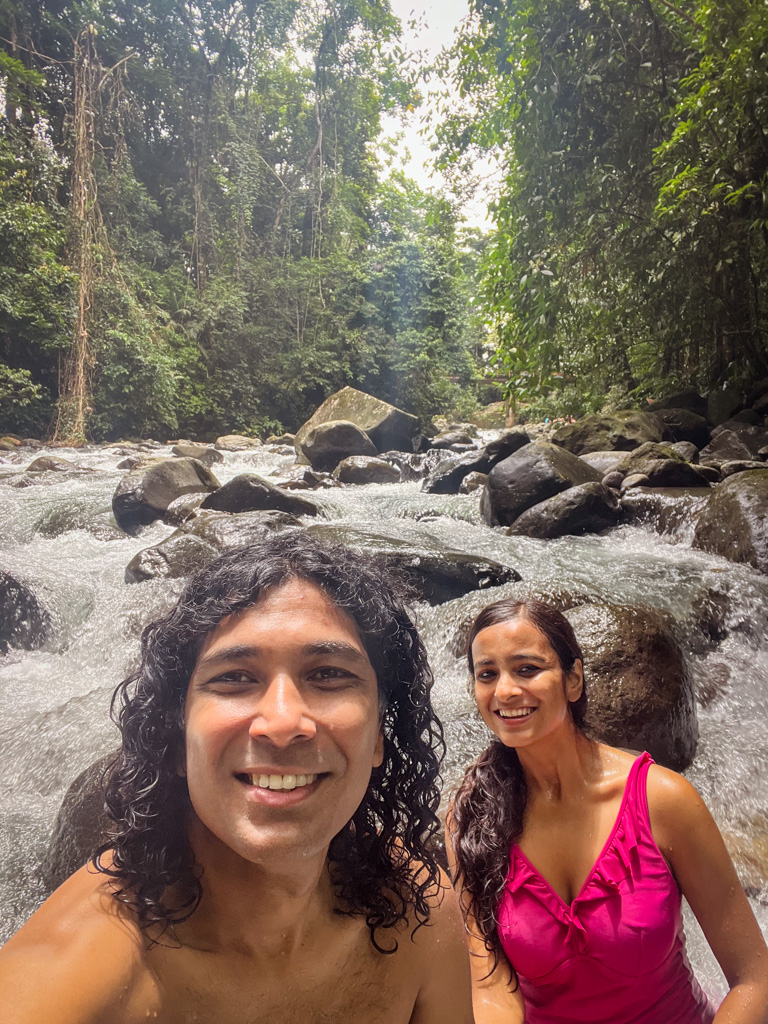 Couple at a river stream in La Fortuna, Costa Rica.