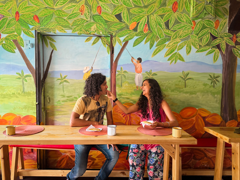 Couple sharing moments together, savoring empanadas and coffee. Romantic things to do in Costa Rica.