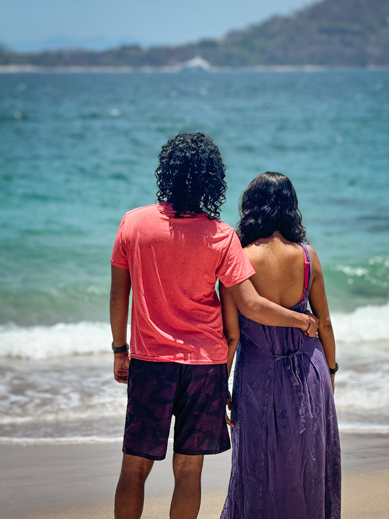 A man and a woman standing on a beach in Guanacaste, Costa Rica