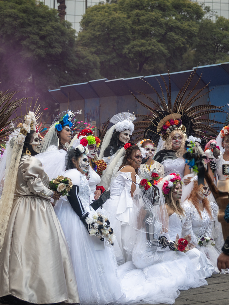 Women dressed as La Catarina in Mexico City during a Catarina Parade