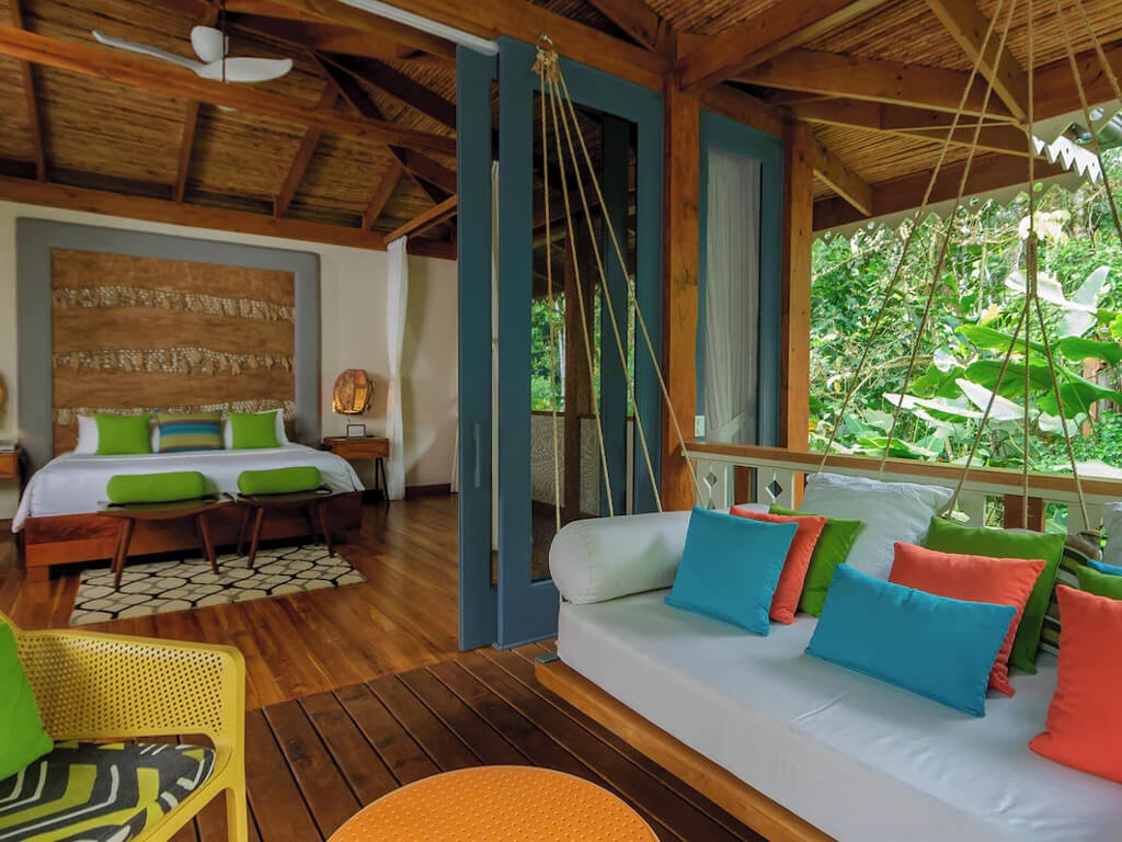 Large patio with forest views in the villa at the Pacuare Lodge in Costa Rica.