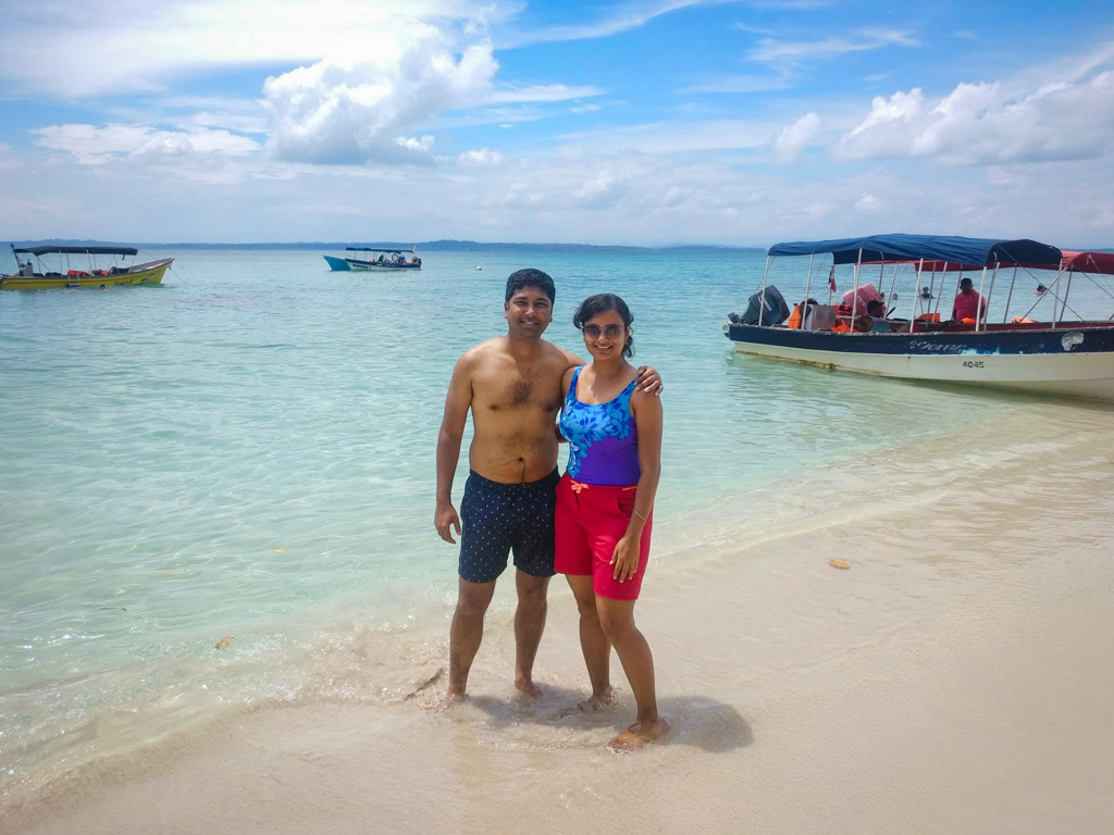 Couple standing at a beach in Bocas del Toro, Panama.