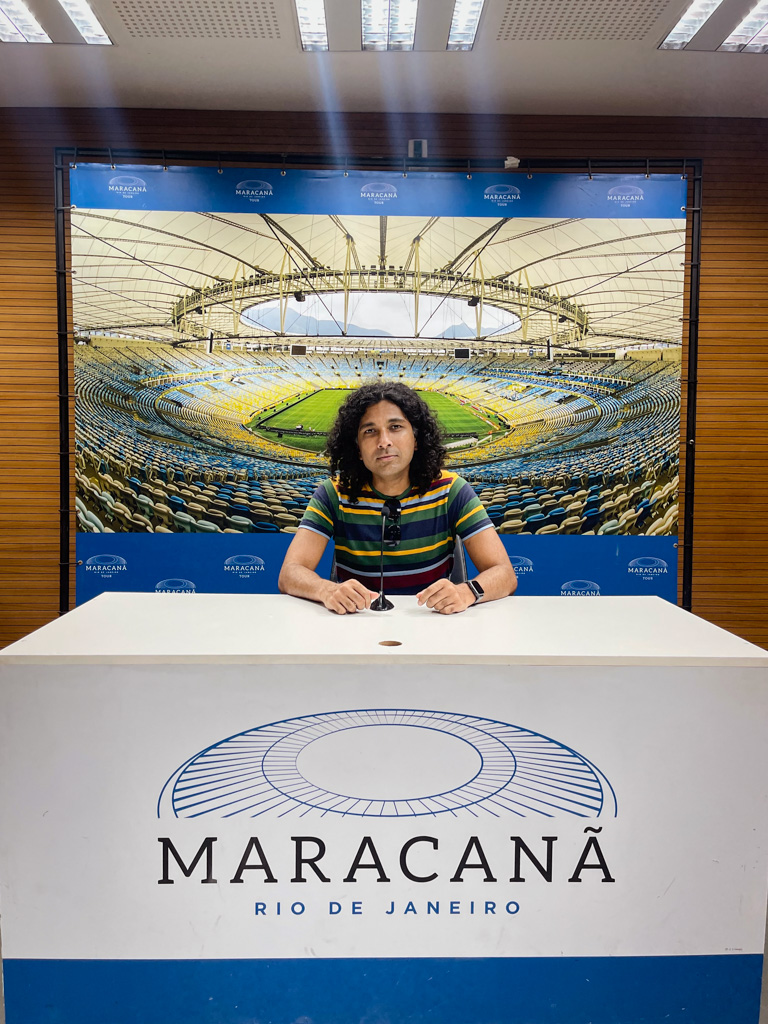 Man, at the press conference table in Maracana.