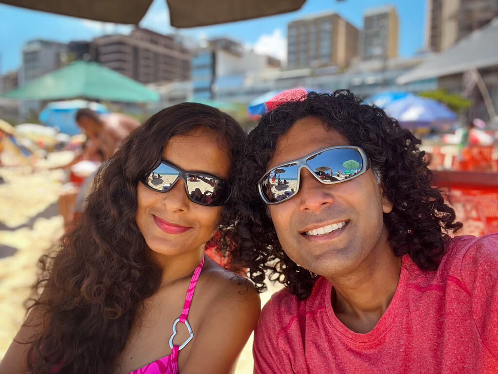 Selfie of a man and a woman at the beach in Rio de Janeiro.