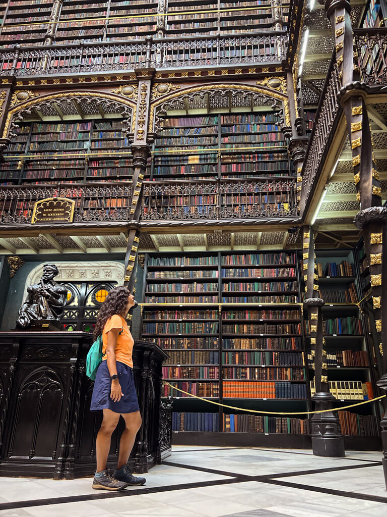 Woman standing inside the Royal Portuguese Reading Room in Rio de Janeiro.