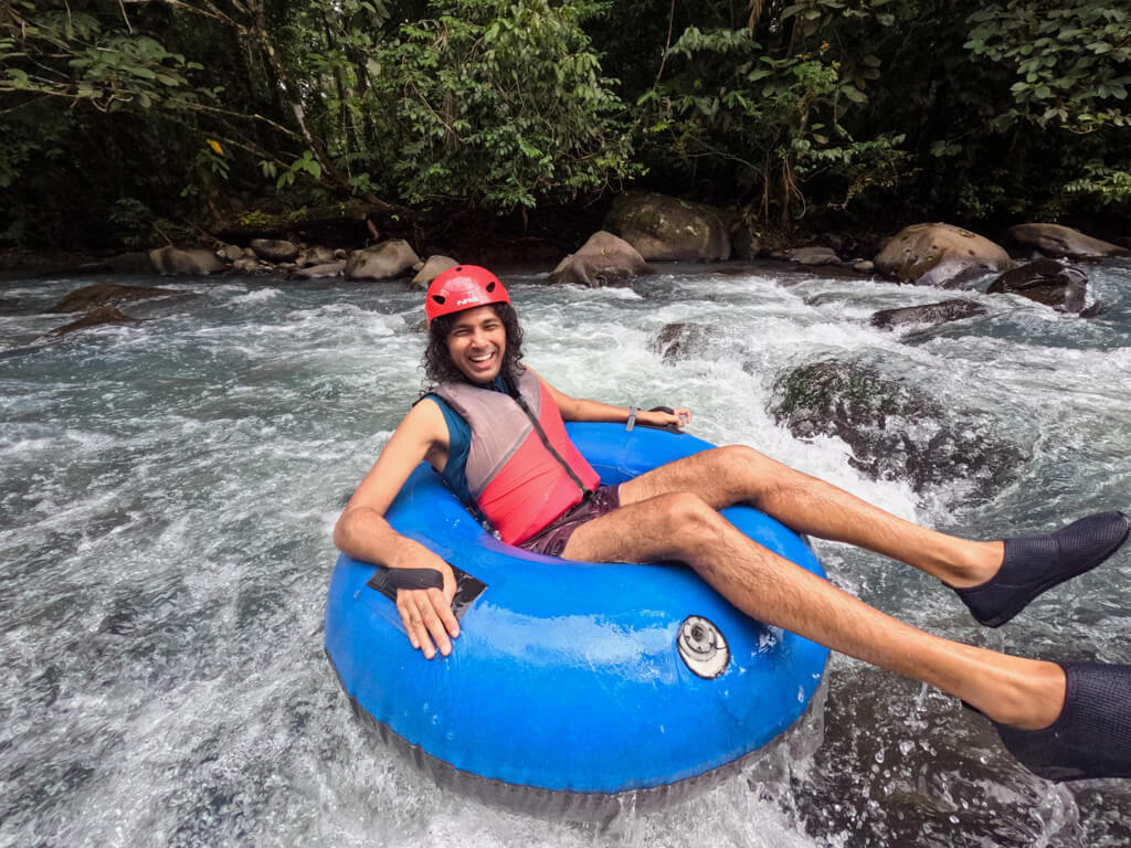 A man during river tubing in Rio Celeste in Costa Rica.