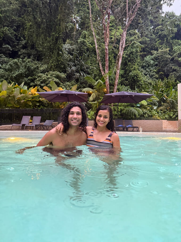 A woman and man, at the thermal pool of Hot Springs Pura Vida at La Fortuna, Costa Rica.