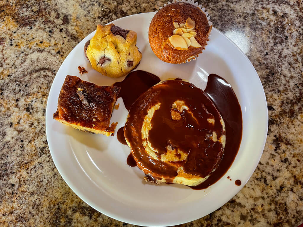 An assortment of baked goods on a plate, kept on the table. At the buffet breakfast of Los Lagos Hotel Resort & Spa.