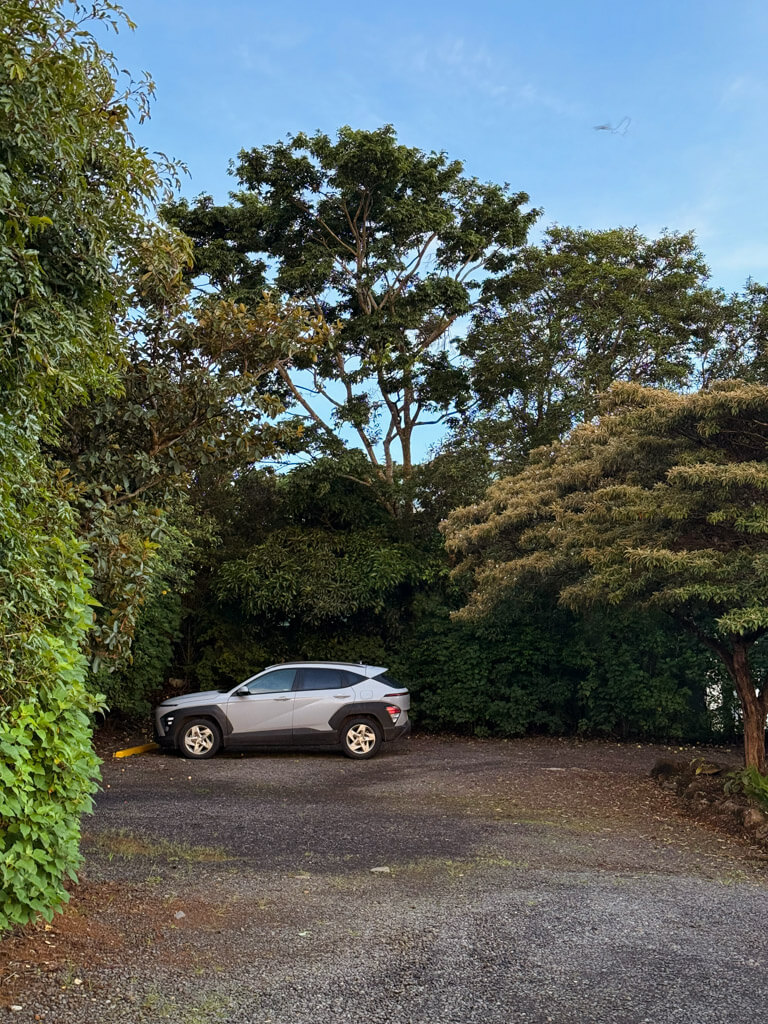 A rental car parked at the parking lot of a hotel in Monteverde, Costa Rica.