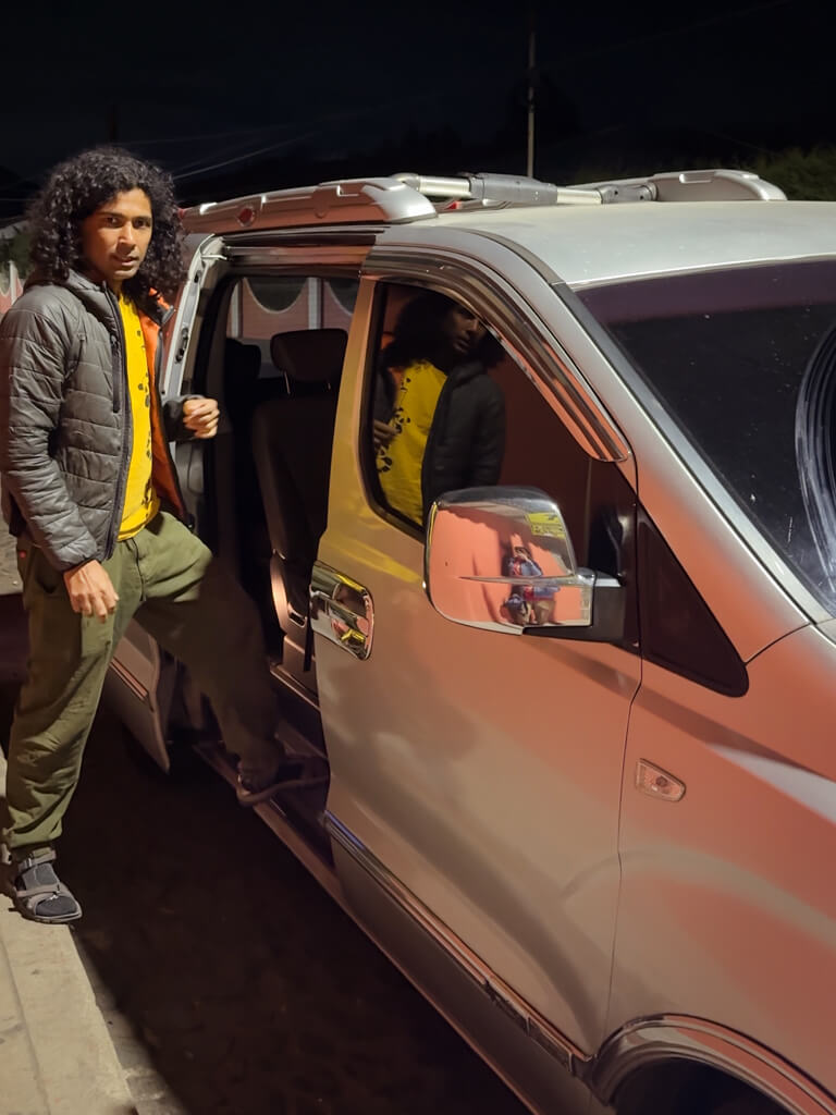 A man boarding a car, a private transfer from Antigua Guatemala to Guatemala City Airport.